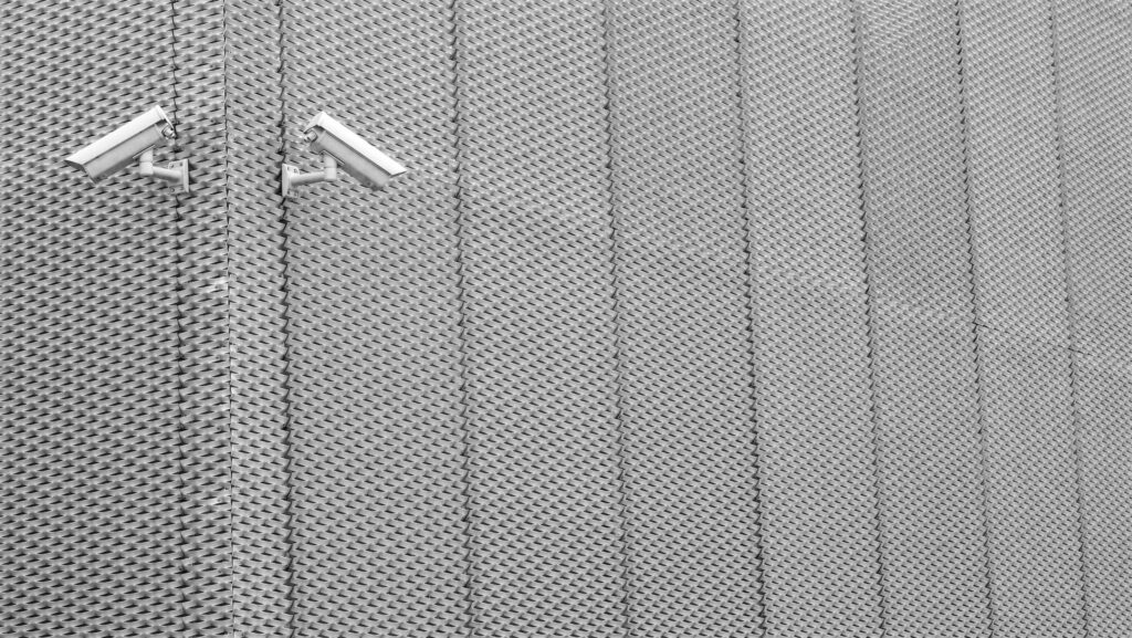 Two Gray Cctv Cameras on Wall